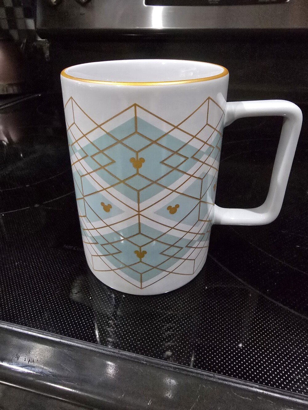 Decorative White Ceramic Mug with Aqua Geometric Pattern and Gold Accents